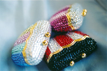 Imported from China, these pillboxes feature Swarovski ® crystals and a black velveteen interior. 