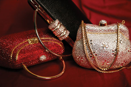 Imported from Italy, these evening bags feature Swarovski ® crystals, gold leather interior, and a hand-woven Italian chain.